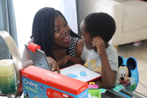 Mother and Child playing Osmo Coding Kit