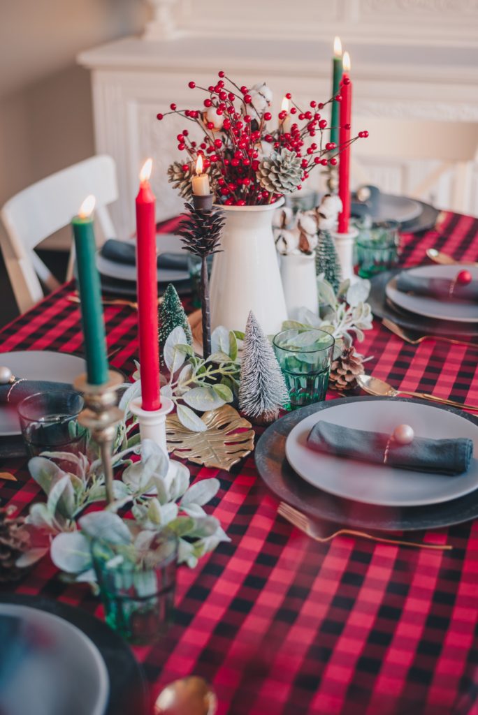Image of a dinner table set with red and green table setting