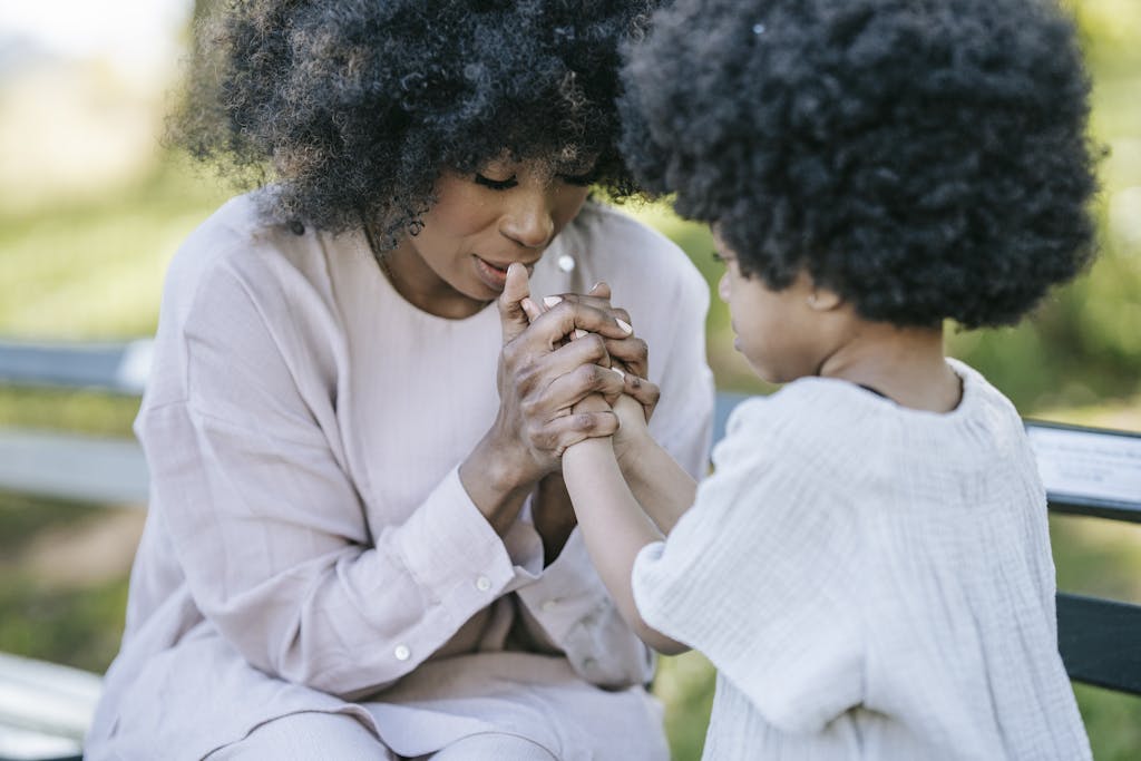 A Woman and a Young Girl Praying Together; prayer